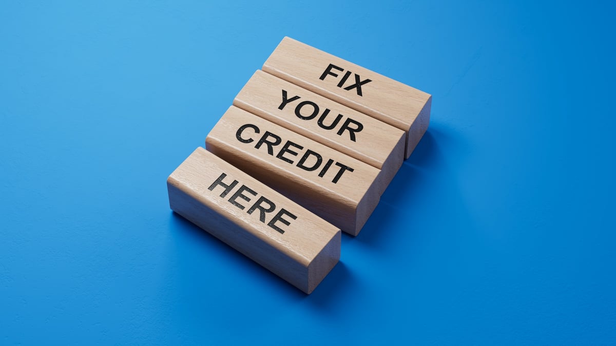 Fix your credit here symbol rendered on a blue background